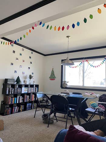 a reviewer's home with holiday string light felt garland hung