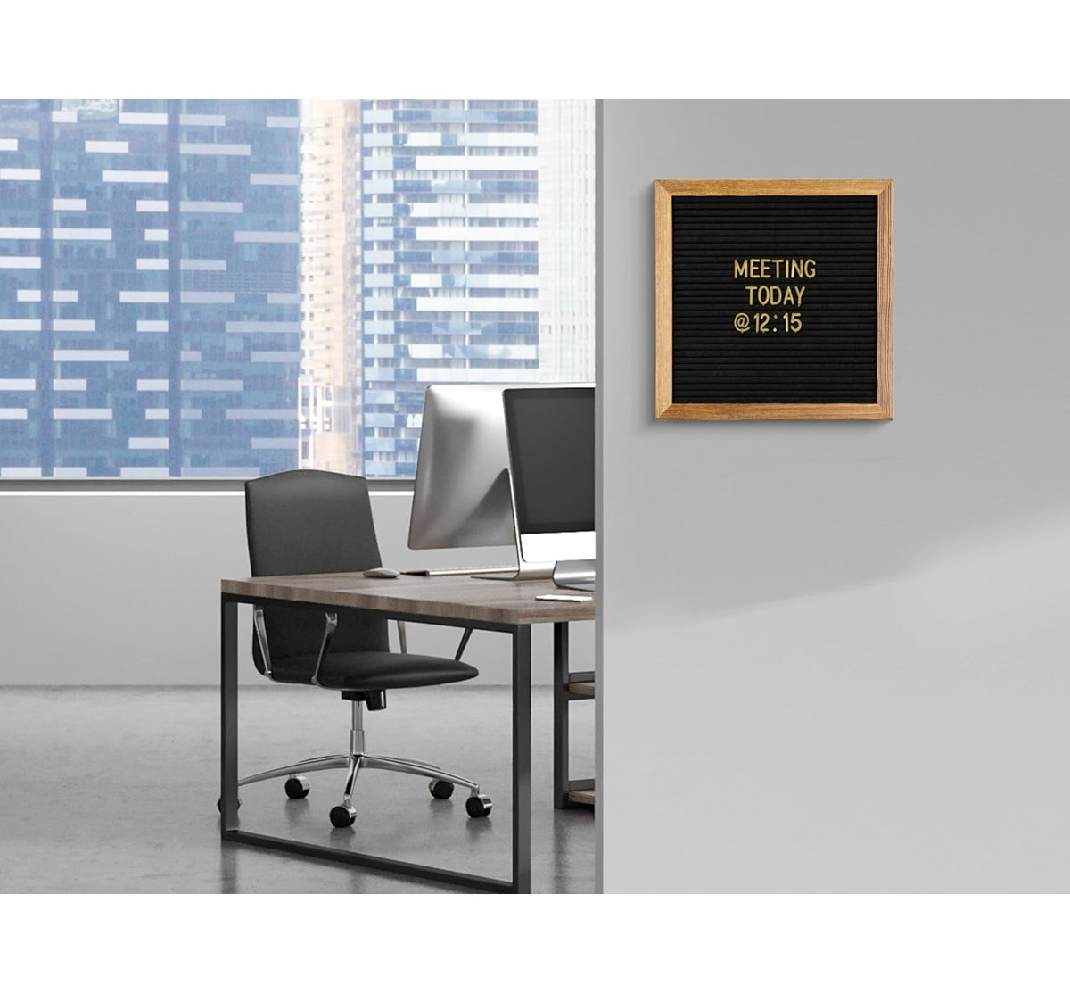 Office space with a desk and computer; wall-mounted sign reads, 