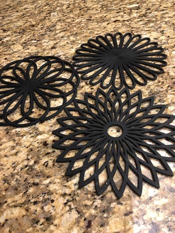 a reviewer photo of the the trivets in black 