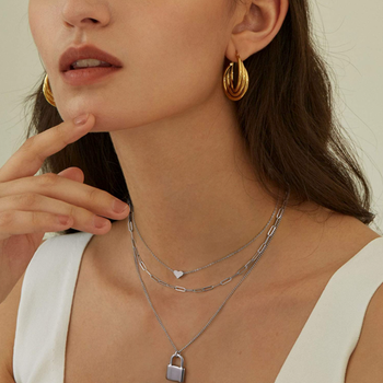 a model wearing all three necklaces