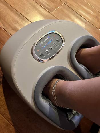 Reviewer's feet in an electronic foot massager