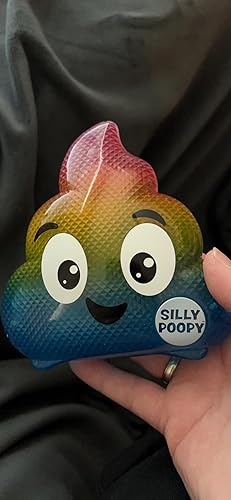 Hand holding a rainbow-colored, smiling poop artifact  labeled 