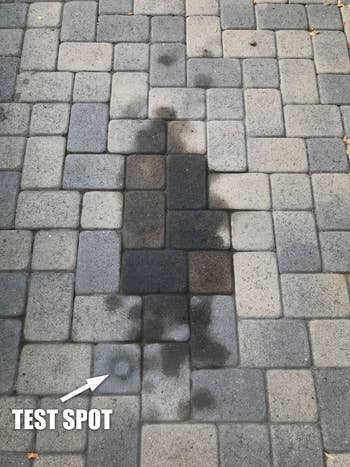 A large stain on reviewer's paver stones, plus a clean test spot