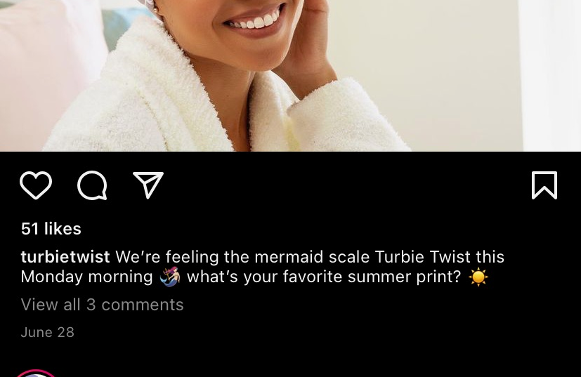 model wearing the mermaid-patterned towel wrap