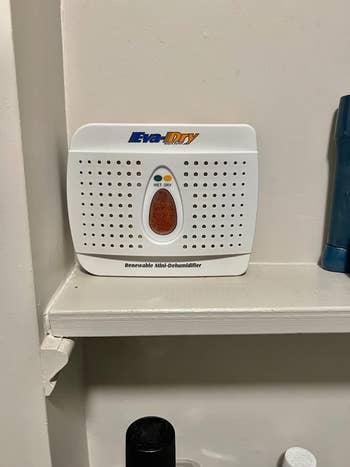 reviewer photo of the dehumidifier sitting on a shelf
