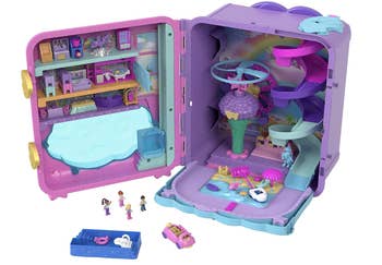 Toy playset with mini dolls, featuring a elaborate location and an enactment country with slides and a pool. Includes a car and tiny accessories
