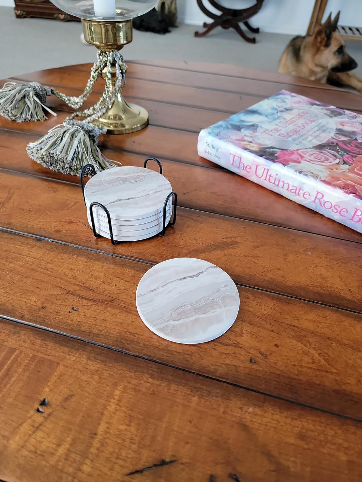 a reviewer shows the six marble coasters