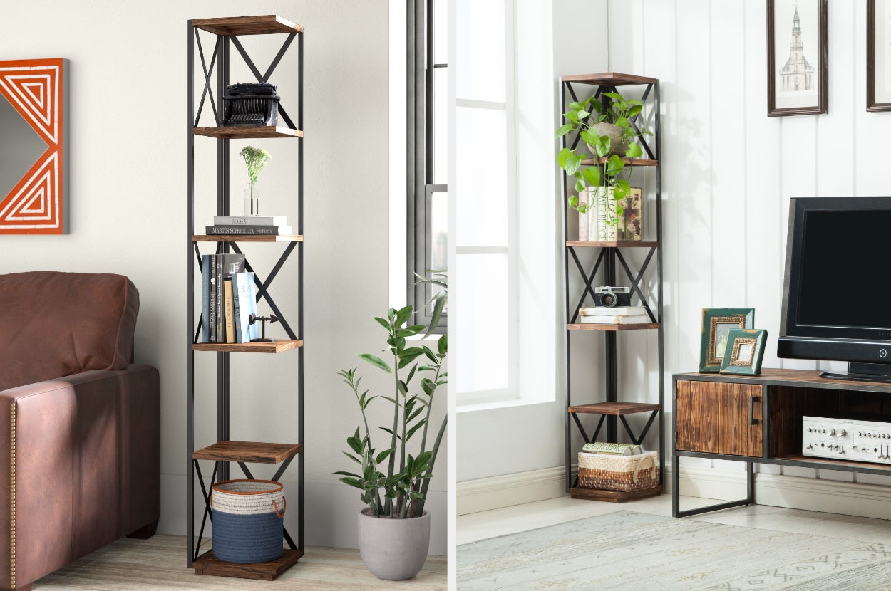 Black and brown six-tier corner bookshelf with books and decor on display, zoomed out view of product next to window and TV