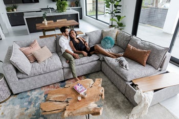 overhead view, couple sitting on gray L-shaped couch