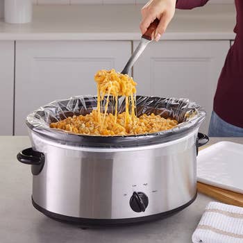 model scooping mac and cheese out of a crock pot
