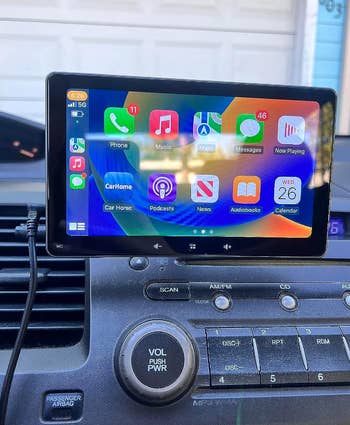 reviewers touch screen attached to their dashboard showing the home screen