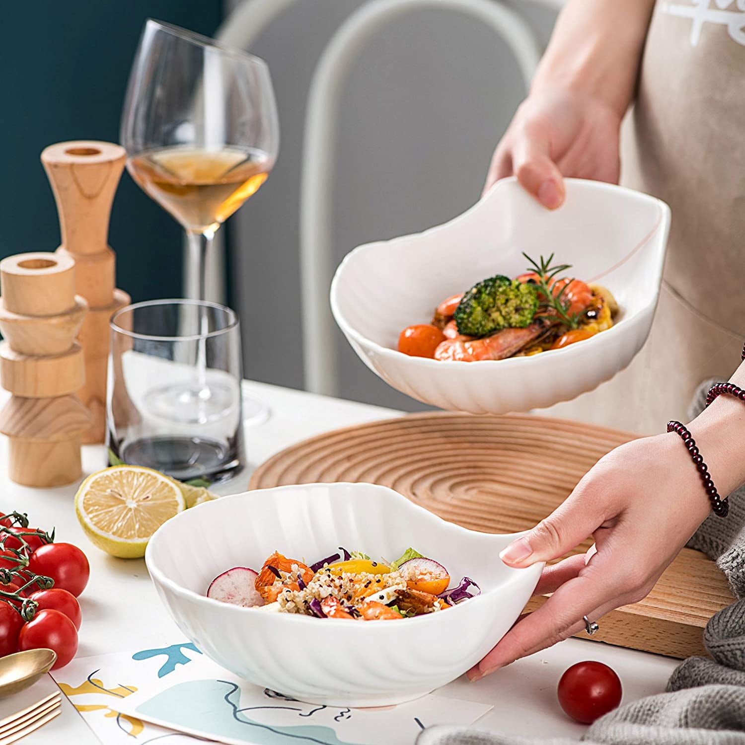 A model serving a quinoa salad in a white shell-shaped plate