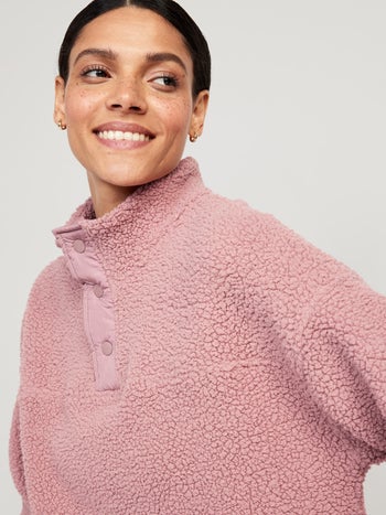 a close up of the sweater in pink