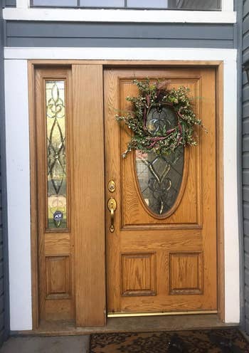 before photo of reviewer's plain wood front door