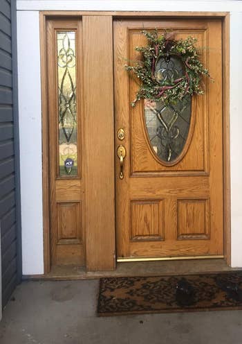 before photo of reviewer's plain wood front door