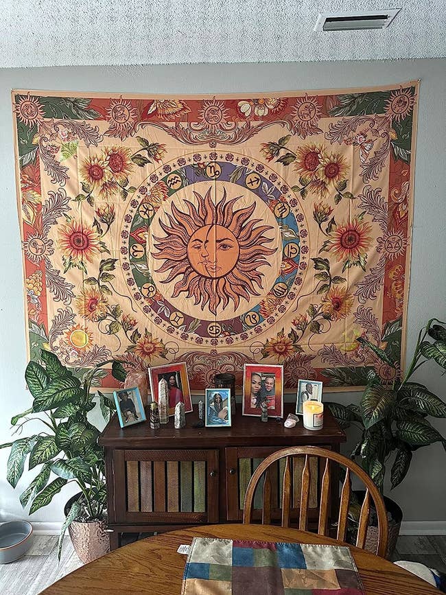 reviewer image of the tapestry hanging on a wall in a dining room