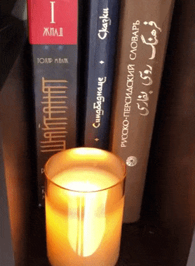 gift showing the candle flickering realistically on a shelf