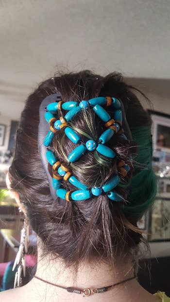 reviewer photo of back of head, wearing the turquoise clip comb