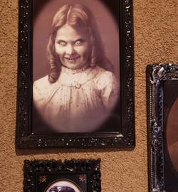 the same portrait viewed from a different angle, showing a more malevolent look on the little girl's face