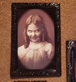 the same portrait viewed from a different angle, showing a more malevolent look on the little girl's face