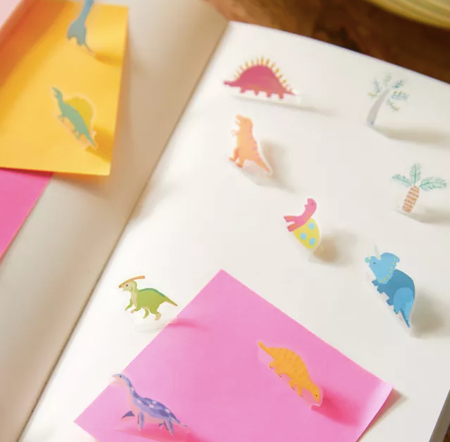 tiny dinosaurs on notebook
