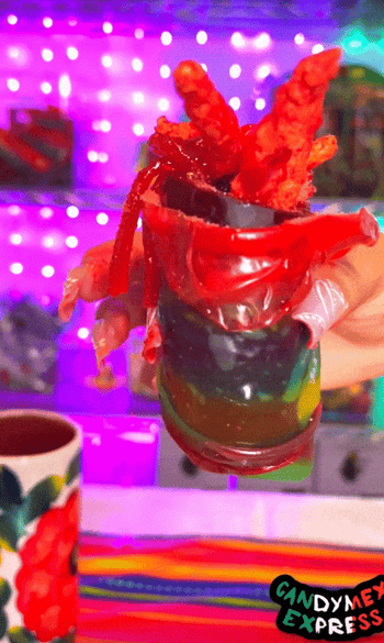 gif of business from TikTok making the chamoy candy pickle