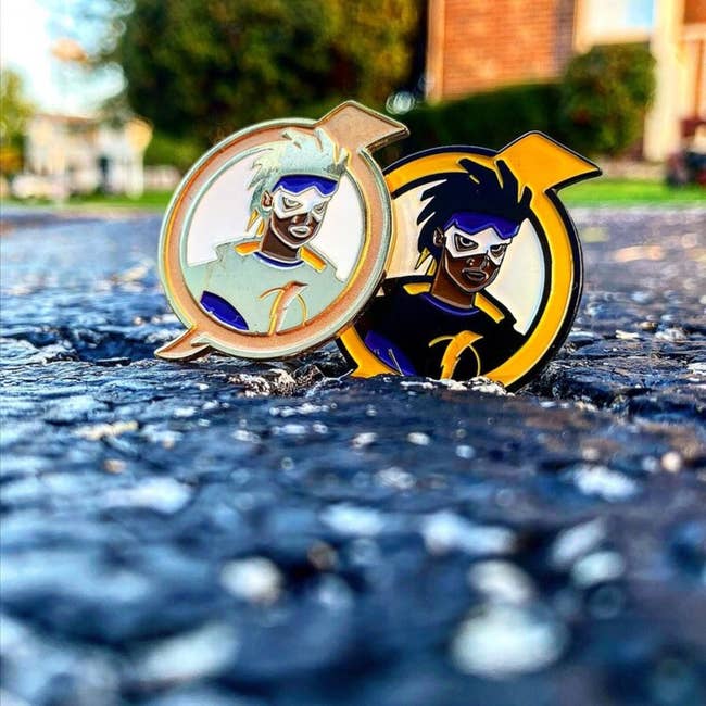 Static Shock pins in gold and black