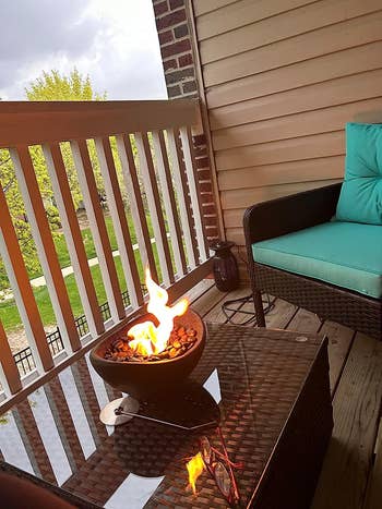 mini fire pit on reviewer's balcony table
