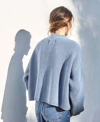 model showing the back of the cardigan