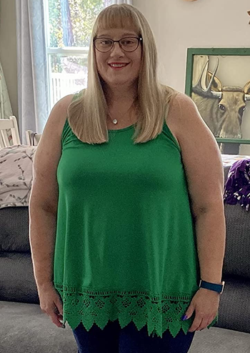 Image of reviewer wearing green tank top