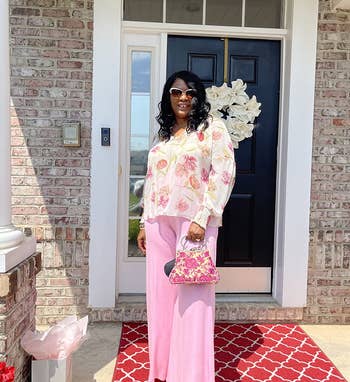 reviewer wearing pink palazzo pants on a front porch