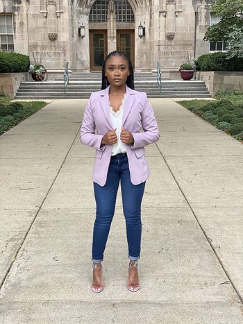 reviewer wearing the lilac version with jeans and heels