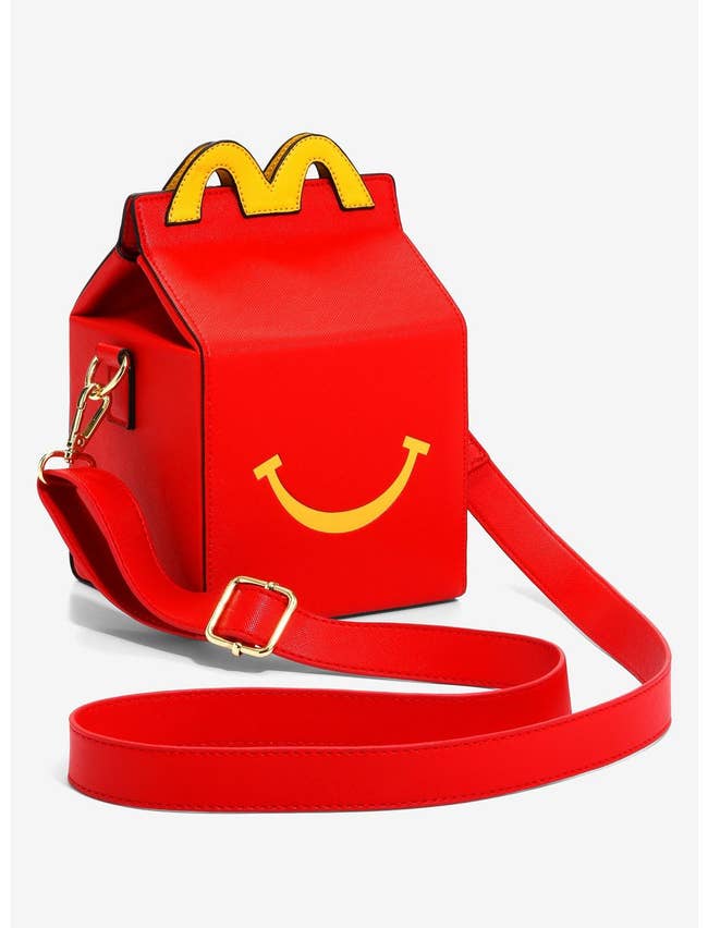 faux leather bag that looks like a mcdonalds happy meal box with a strap 