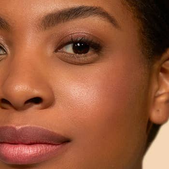 Close-up of a person's look   with creaseless  skin, subtle makeup, and brushed  lips. Suitable for a quality   oregon  skincare merchandise  diagnostic   successful  buying  content