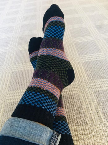 image of blue patterned socks on reviewer's feet