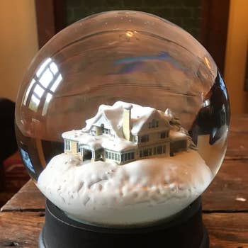 house in snow in snow globe