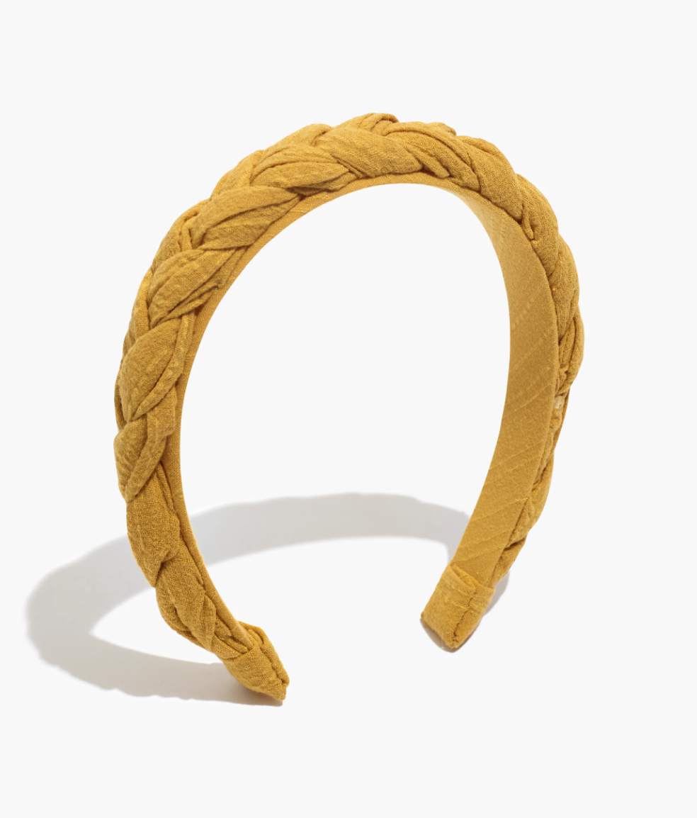a mustard colored thick braided headband