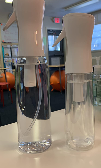 Two different sized water misters next to each other