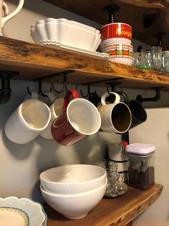 reviewer photo of mugs on under-shelf hooks