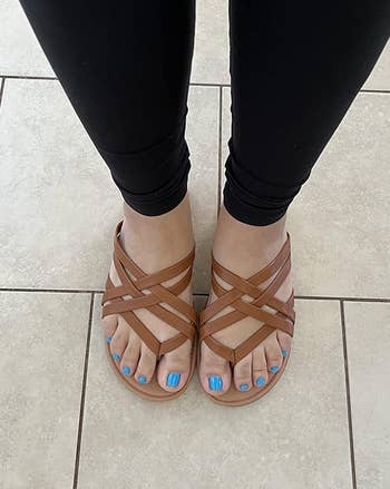 reviewer wearing the brownish sandals