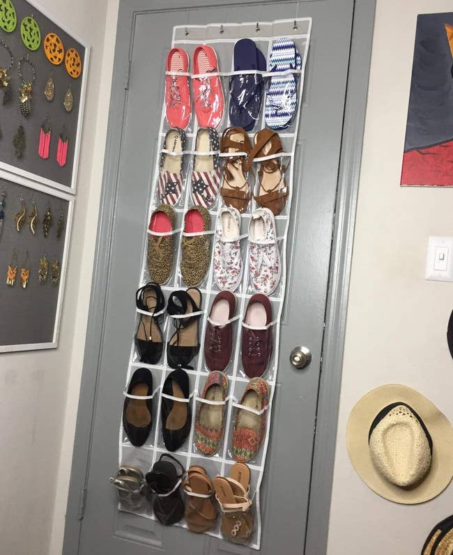 reviewer's shoe holder on back of door full of shoes
