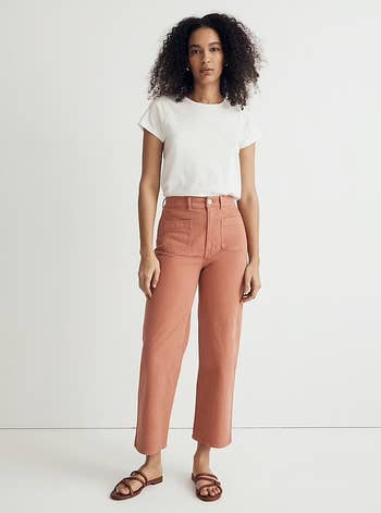 a model wearing the same pants in a dusty pink 