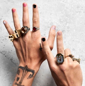 harry styles wearing different shades of pleasing nail polish on his nails