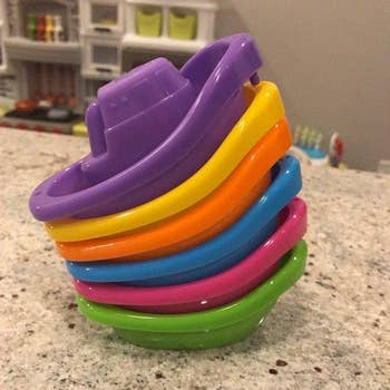 a stack of colorful toy boats
