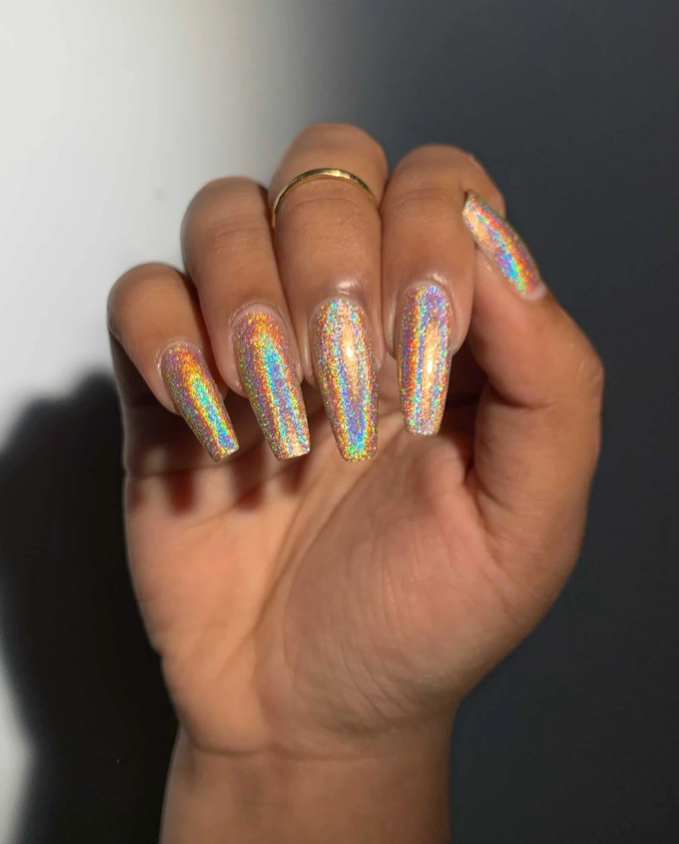 A model with holographic white nails 
