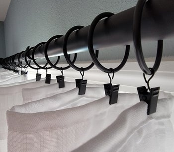 a reviewer's white curtains hung from dusky curtain rings
