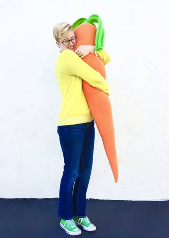Model hugging the carrot pillow