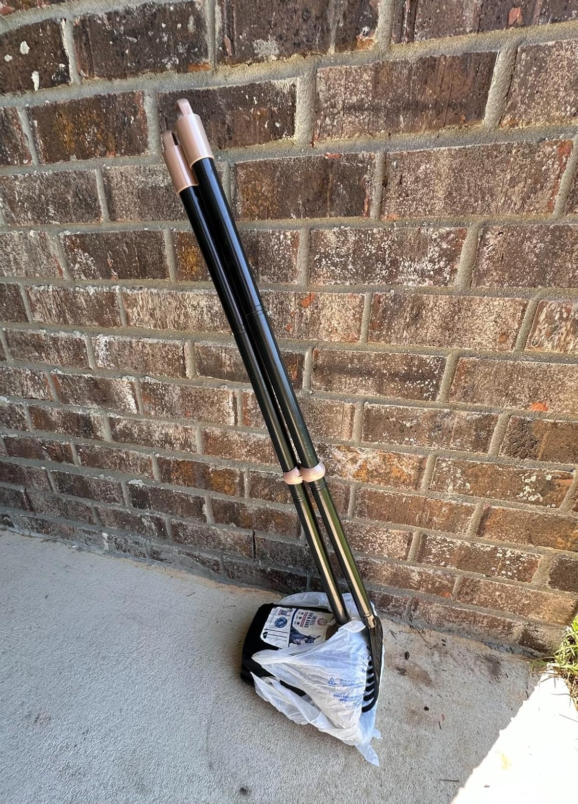 A acceptable   of 4  stacked frying pans with lids connected  a structure  adjacent  to a ceramic  wall, inactive  successful  packaging, acceptable   for reappraisal  oregon  purchase