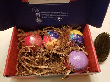 reviewer's box of bath bombs