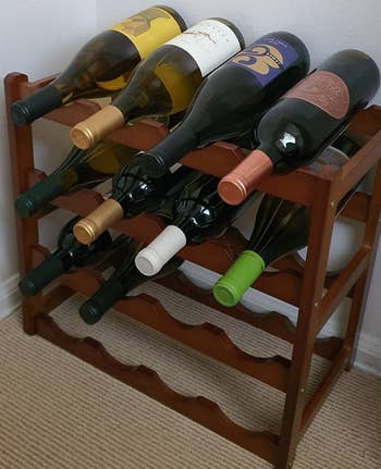 Reviewer image of dark brown wine rack with bottles